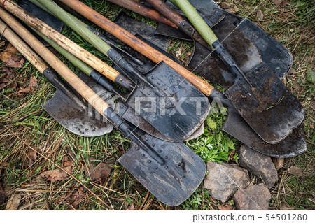 Metallic shovel with wooden handle isolated on white background, farm tools, clipping path included Metallic shovel with wooden handle isolated on white background, farm tools, clipping path included 54501280
