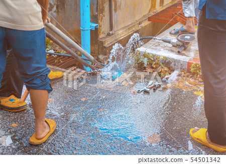 plumber working repair the broken pipe  54501342