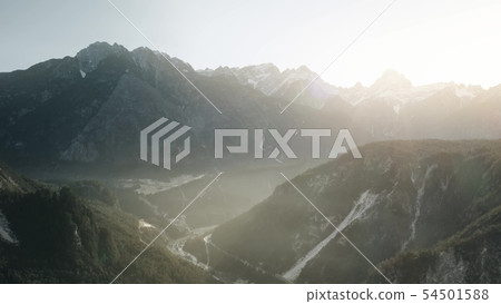 Misty river valley in the Alps in winter, aerial view Misty river valley in the Alps in winter, aerial view 54501588