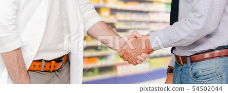 Doctor in hospital handshake with another doctor. 54502044