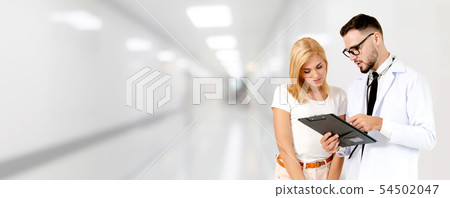 Doctor talking to patient in the hospital. 54502047