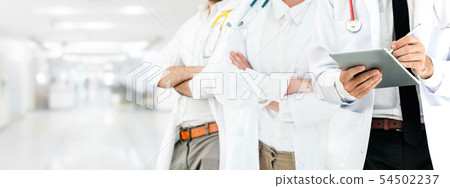 Doctor working in hospital with other doctors. 54502237