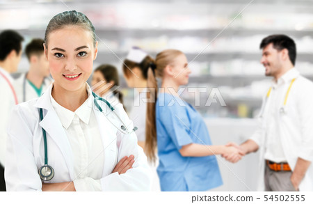 Doctor working in hospital with other doctors. 54502555