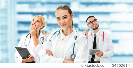 Doctor working in hospital with other doctors. 54502614