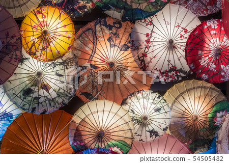 Multi colored chinese umbrellas illuminated at night 54505482