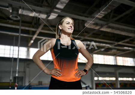 Sportive blonde woman posing at indoor stadium 54506820