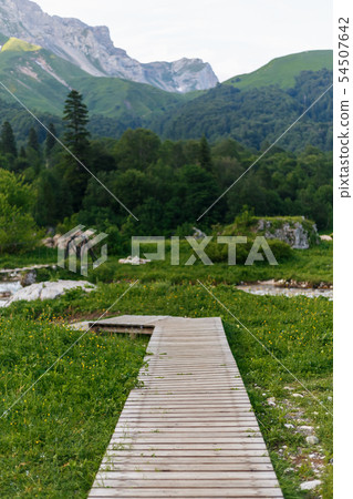 Wooden path to the mountains for tourists. Path 54507642