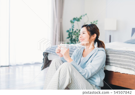Young woman relaxing in the room Young woman relaxing in the room 54507842