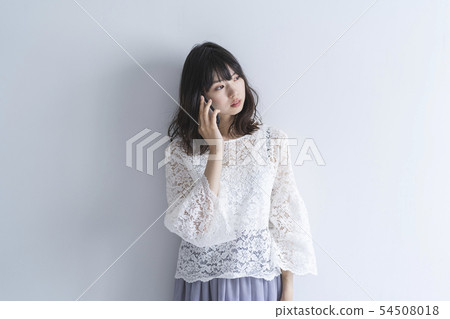 Woman using a smartphone Woman using a smartphone 54508018