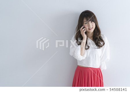 Woman using a smartphone Woman using a smartphone 54508141