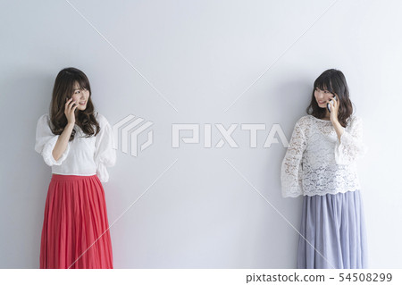 Woman using a smartphone Woman using a smartphone 54508299
