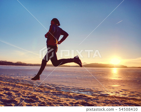 Slim body person is running. Beach sand with Slim body person is running. Beach sand with 54508410