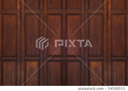Dark brown ancient wooden swing door background. Dark brown ancient wooden swing door background. 54508553