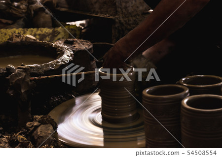 Close up hand of potter do a clay vase thai style. Close up hand of potter do a clay vase thai style. 54508554