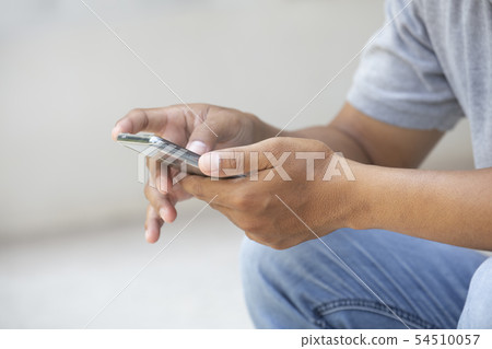 Closeup hand of Asian man teen using smart phone 54510057