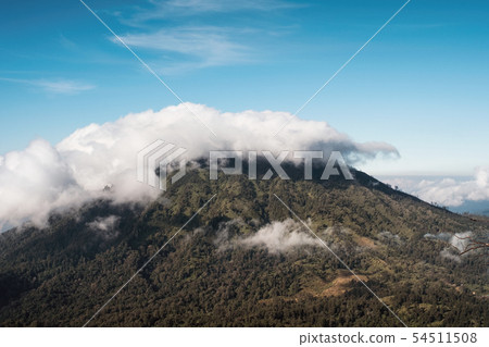 Clouds covered on peak volcano in the morning 54511508