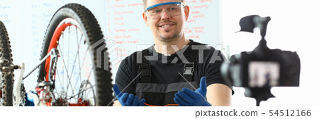 Joyful Engineer Taking Care of Mountain Bicycle 54512166