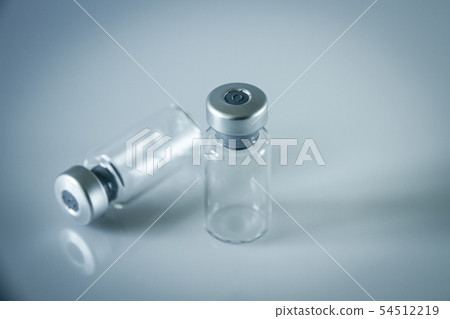 two vaccine bottles on grey background two vaccine bottles on grey background 54512219