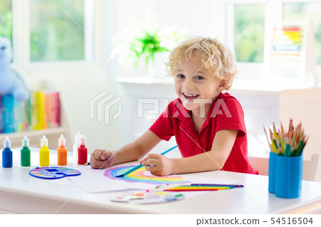 Kids paint. Child painting. Little boy drawing. 54516504