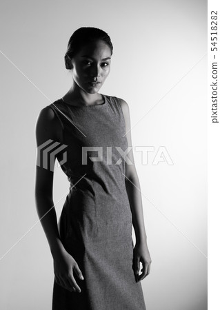 Fashion Asian Woman Tan skin black hair eyes Fashion Asian Woman Tan skin black hair eyes 54518282