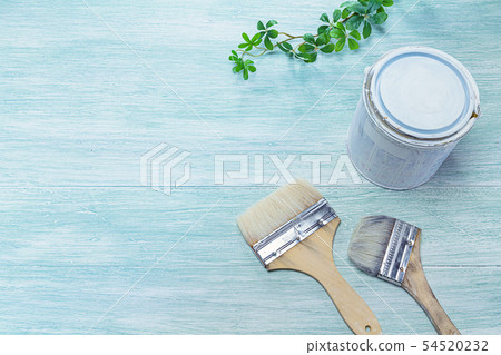 Paint and brush placed on a wooden board 54520232