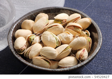 Pistachio and glass liquor. A snack image of sake. 54520427