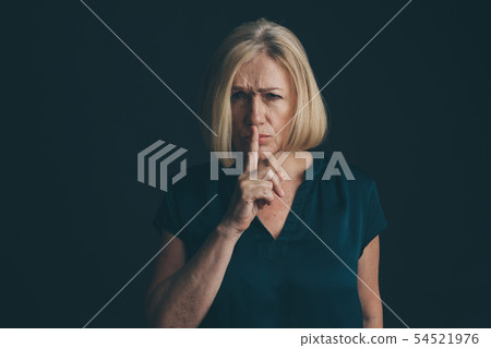 Woman showing to keep silence isolated. 54521976