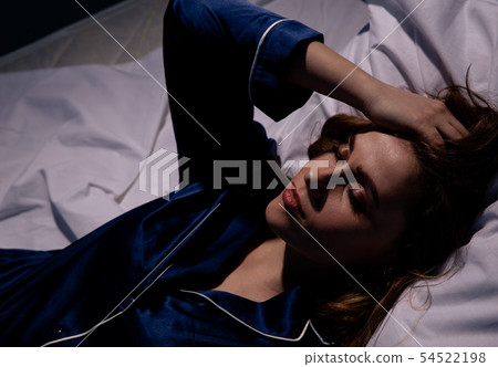 Sleepless female in the bed in the dark. Insomnia at home concept. 54522198