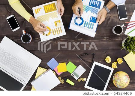 Two people working in an office 54524409