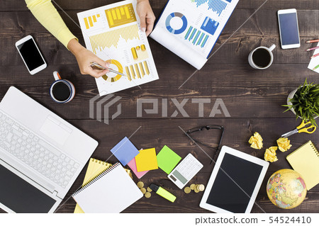 Woman working an office table 54524410