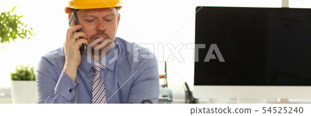Caucasian Engineer Working on House Blueprint 54525240