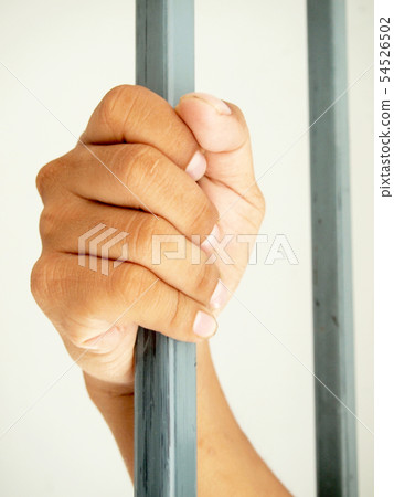 hands behind bars hands behind bars 54526502