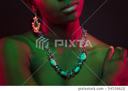 Colorful and creative portrait of african womans upper body with dark skin 54526628