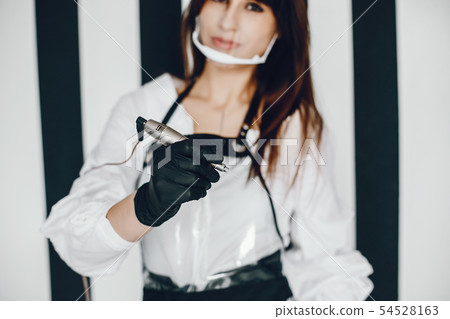 Elegant woman with eyebrow tool Elegant woman with eyebrow tool 54528163