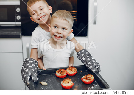 Little girl cook the dough for cookies Little girl cook the dough for cookies 54528561