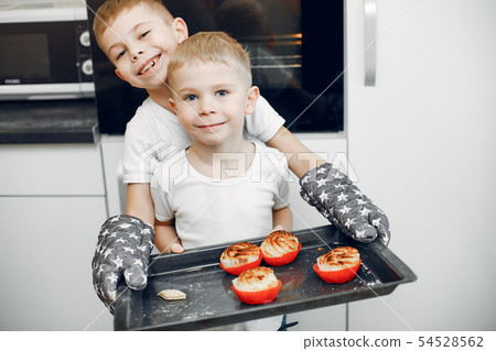 Little girl cook the dough for cookies Little girl cook the dough for cookies 54528562