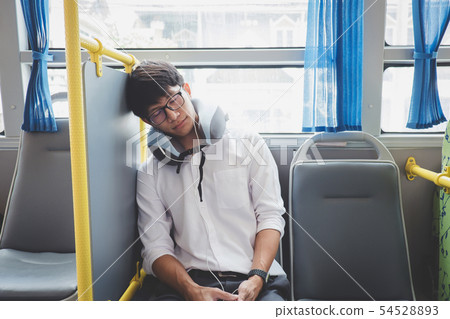 Young Asian man traveler sitting on a bus and 54528893