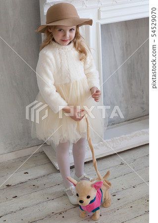 Beautiful girl with soft toy puppy dog 54529070