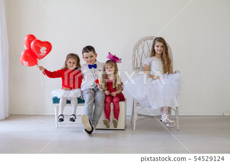 Kids boy and girls with red balloons Kids boy and girls with red balloons 54529124
