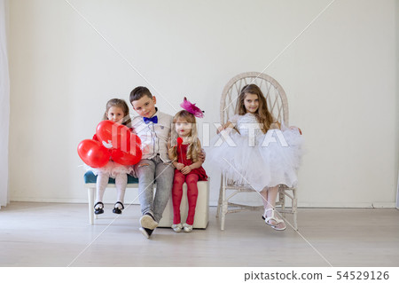 Kids boy and girls with red balloons Kids boy and girls with red balloons 54529126