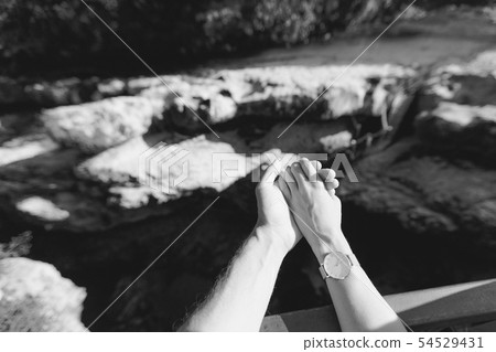 male and female hand holding each other 54529431