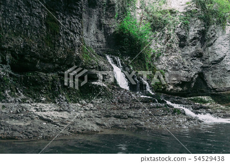 Mountain river waterfall view Mountain river waterfall view 54529438