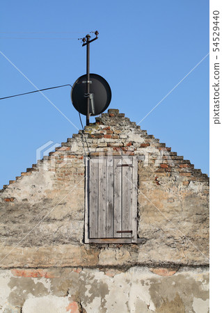 Old house and satelite antenna 54529440