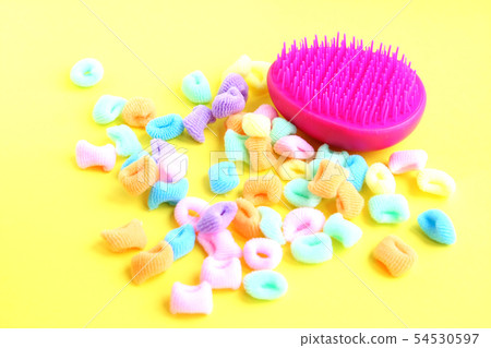 Pink comb and bright multi-colored scrunchies on 54530597