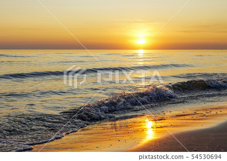 beautiful sunset on the Baltic Sea coast in Latvia beautiful sunset on the Baltic Sea coast in Latvia 54530694