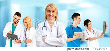 Doctor working in hospital with other doctors. 54534914