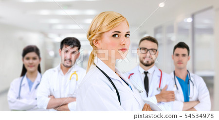 Doctor working in hospital with other doctors. Doctor working in hospital with other doctors. 54534978