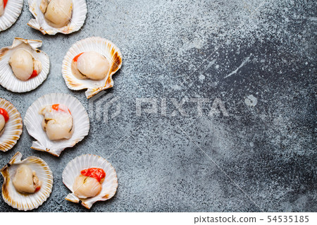 Raw fresh uncooked scallops Raw fresh uncooked scallops 54535185