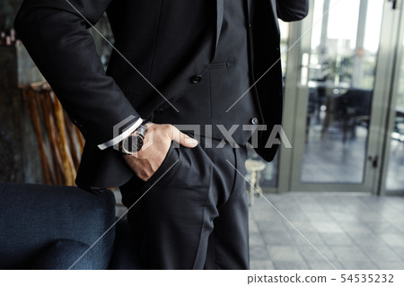 Close up of handsome businessman, working on laptop in restaurant Close up of handsome businessman, working on laptop in restaurant 54535232