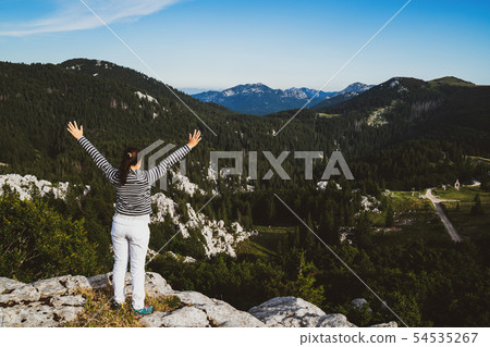 Woman traveler hiking across Croatia landscape. Woman traveler hiking across Croatia landscape. 54535267